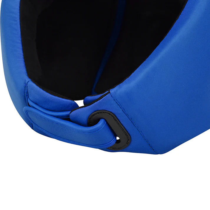 Close-up of a blue helmet with a black strap on a white background