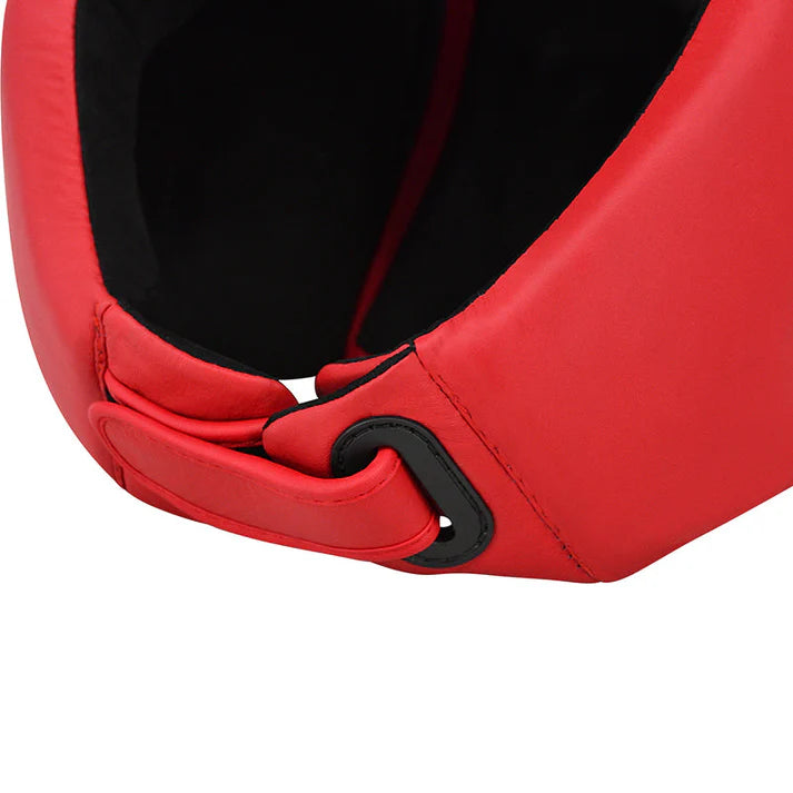 Close-up of a red boxing glove with a black strap on a white background